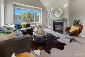 Big formal living room with vaulted ceilings and gas fireplace
