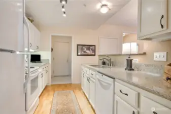 Pantry/laundry located off kitchen as you approach garage door access.