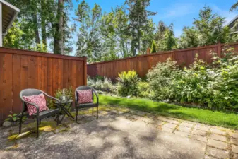 The large private patio connects you to the common, professionally tended gardens.