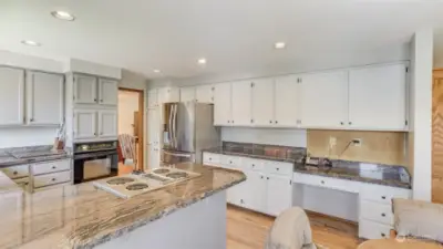 There is so much storage and counter prep space in this open kitchen.