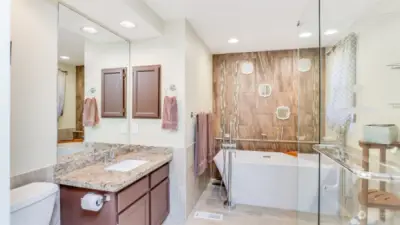 Soak a long day away in this stunning primary bathroom.