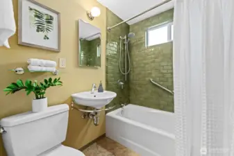 Fully remodeled bathroom with beautiful ceramic tile tub surround. Plumbing in this home has been updated.