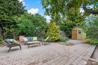 Plenty of outdoor space for play, relaxation and gardening. This patio enjoys sun and is ideal for pots or a container garden.