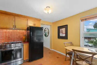 Ceramic tile backsplash, Marmoleum floors, new range and dishwasher, this kitchen has been carefully updated.