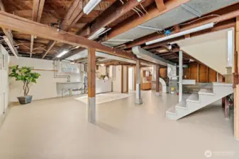 Expansive and freshly painted, this versatile basement is brimming with potential—ideal for a home gym, creative workspace, or future customization. Featuring laundry hook-ups, a ¾ bathroom, built-in storage, and a convenient side entrance at the top of the stairs, this space offers endless possibilities—including the potential for an ADU!