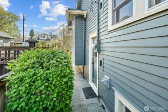 A closer look at the side entrance—perfect for separate access to the basement, or ADU access, or as a practical mudroom entry after gardening or enjoying the outdoors.