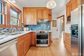 This well-appointed kitchen offers stainless steel appliances, including a gas range and double oven—perfect for the home chef.
