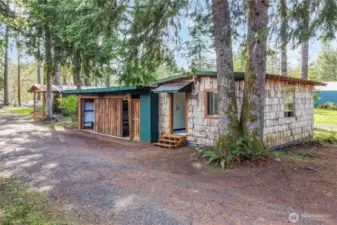 Outbuilding with finished studio on one side.