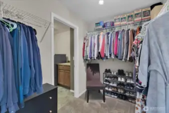 Primary walk in closet. connected to laundry