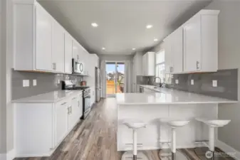 View of kitchen w/ eating space.