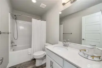 Shared full bath; upper floor.