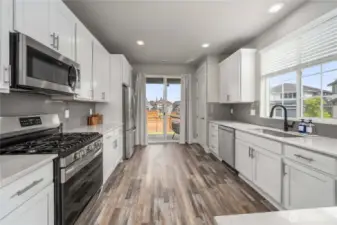 Modern kitchen w/ stainless appliances.