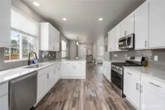 Modern kitchen w/ stainless appliances.