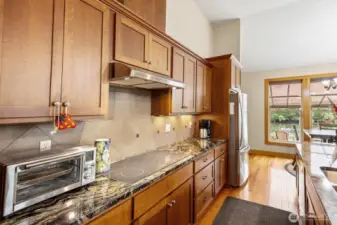 Flat top kitchen stove and stainless-steel refrigerator for all your cooking needs