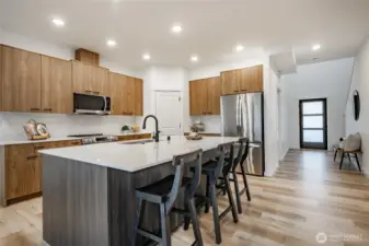 Photos shown are of a similar floor plan previously built in a different neighborhood (The Ridge in Blaine). Finishes and features may vary. Some items pictured reflect buyer-selected upgrades which are not included in the base price and may be added at an additional cost.