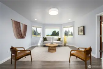 Family room open to the kitchen, adjoining the formal dining room.