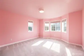 Upstairs pink front bedroom.