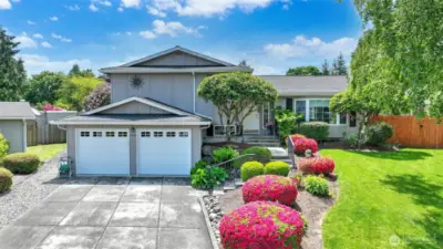 Welcome to this beautifully maintained tri-level home in the desirable Fairwood area. Offering thoughtfully designed living spaces w/a fully finished daylight basement is perfect for both everyday comfort & entertaining. The inviting living room features a cozy wood burning fireplace, while large windows fill the space w/natural light. A spacious kitchen & dining area flow seamlessly to the backyard, making indoor/outdoor living a breeze. Situated on a generous lot, the property offers plenty of room for gardening, play, or relaxation. Enjoy the convenience of an attached garage, central AC for year round comfort, & mature landscaping. Conveniently located close to schools, parks, King County Library, shops, dining, & easy commuter options.