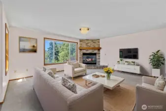 Livingroom with large windows facing the view.