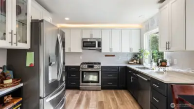 Enjoy generous counter space, ample cabinetry, over cabinet lighting for a softer ambiance, and stainless steel appliances throughout.