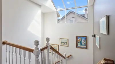 Flooded with daylight, this staircase creates a warm and welcoming entry between levels.