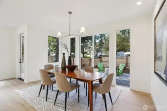 Formal dining room with sliders to front yard patio