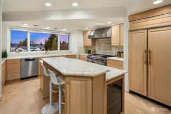 Beautiful warm wood cabinetry, tiered island and chef grade appliances make this a true kitchen for entertaining.