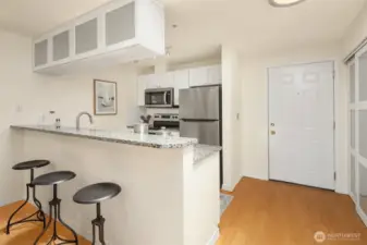 Countertop seating and large pantry to the right
