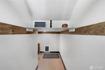 Use for storage or as a doggie hotel. This has a doggie door that leads to an enclosed pet relief area with drainage.