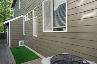 Specialty pet relief area with door to under stairs area.