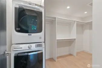 Washer and Dryer in primary walk-in closet.