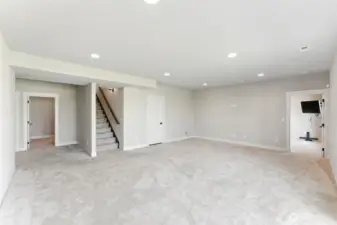 Rec room with storage room to the left and bedroom 3 to the right