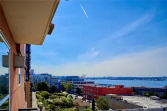 A look due South from the deck over the Belltown P-Patch to the Great Wheel, Stadiums and Mount Rainier. Enjoy watching the ferries, cargo ships and pleasure craft ply Elliott Bay!