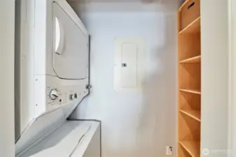 Convenient stack washer & dryer and additional pantry storage.