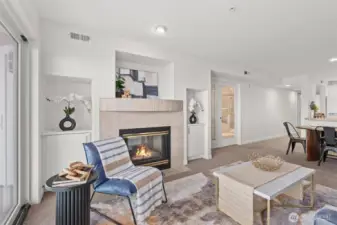 The two-sided gas fireplace opens to the living room and the Primary Suite.