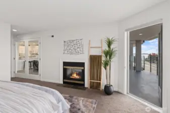 The view-facing Primary Suite features a gas fireplace and access to the view deck.
