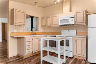 Perfect size kitchen with appliances and a skylight for natural light.