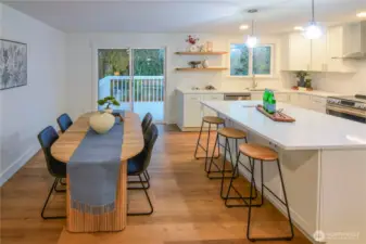 Open-concept kitchen and dining area with seamless flow to the back deck—perfect for entertaining and everyday living.
