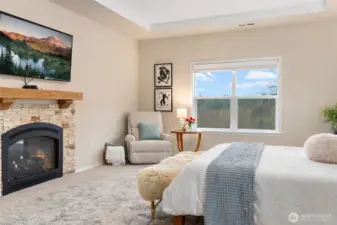 Double sided fireplace in the primary with views of the mountains to wake up to.