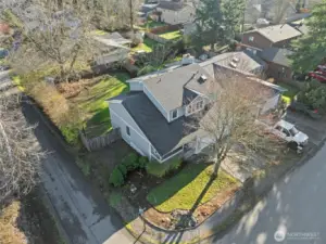 This aerial view highlights the home’s spacious lot and corner setting within the Cherokee Bay Community. The fenced backyard and mature landscaping create a sense of privacy while still offering ample room for outdoor living.