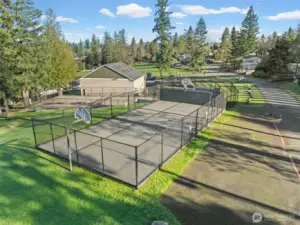 The Cherokee Bay Community offers residents access to multiple recreation courts, including basketball for friendly games and outdoor activities surrounded by lush greenery.