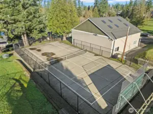 Residents can take advantage of the well-maintained tennis courts, ideal for an active lifestyle in a scenic, wooded setting.