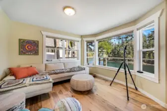 The kitchen expands into a great room full of views.