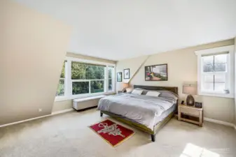 The Primary bedroom is large and overlooks the water