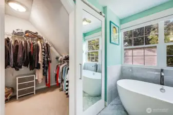The closet is huge and expands behind the shower.