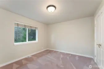 3rd bedroom - facing east. Photo depicts the room without furniture; seller furnishings are currently in the home.
