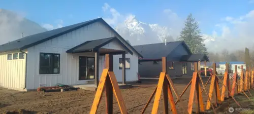 Backyard fence going up for 1172 & new neighboring home. Whitehorse mountain in background.