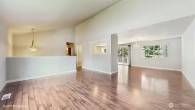 Living Room facing Dining Room and kitchen