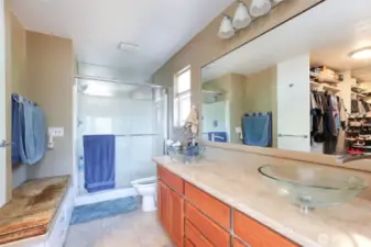Main bedroom bathroom with dual sinks and built in drawers