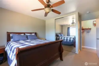 2nd bedroom with mirror closet doors.